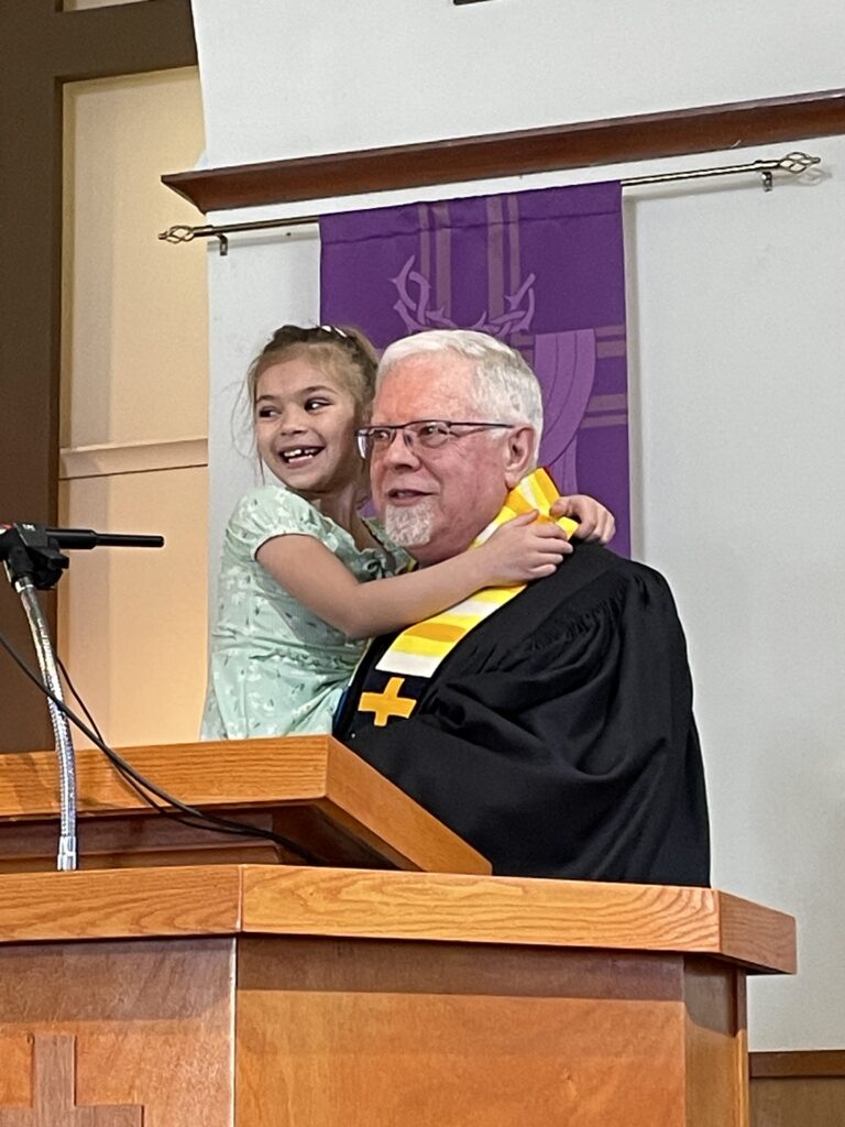 Marilyn helps Pastor Reynolds with Easter Service